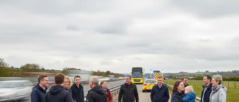 Coach passengers safely evacuated on a UK motorway hard shoulder with emergency services in attendance