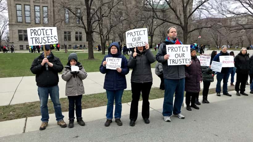 Parents protest outside Queen's Park in Toronto against Ontario school board governance reform legislation tabled April 2026