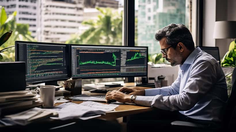 Investidor brasileiro analisando gráficos do Ibovespa em tela de computador