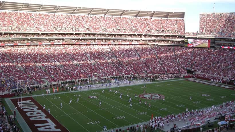 Alabama Crimson Tide football players in game action on the field