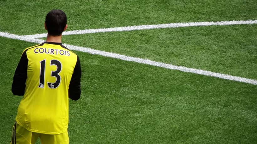 Thibaut Courtois making a save in a football match