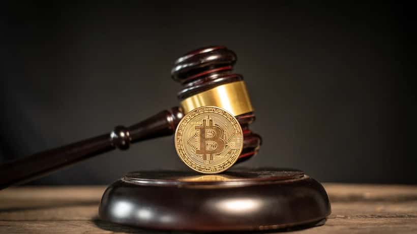 Bitcoin cryptocurrency coins with laws and regulations text, Canadian financial regulation context