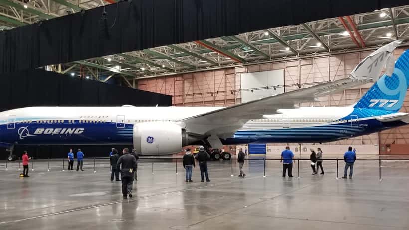 Boeing 777X aircraft at factory roll-out event in Everett Washington, wide-body jet displayed on tarmac