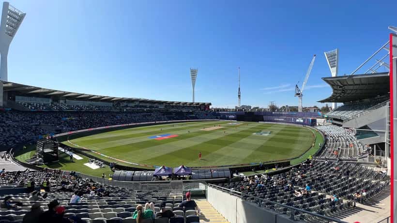 T20 cricket stadium during a match showing the playing field and packed stands