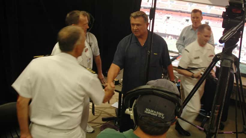 Legendary NFL coach Mike Ditka greets U.S. Navy sailors