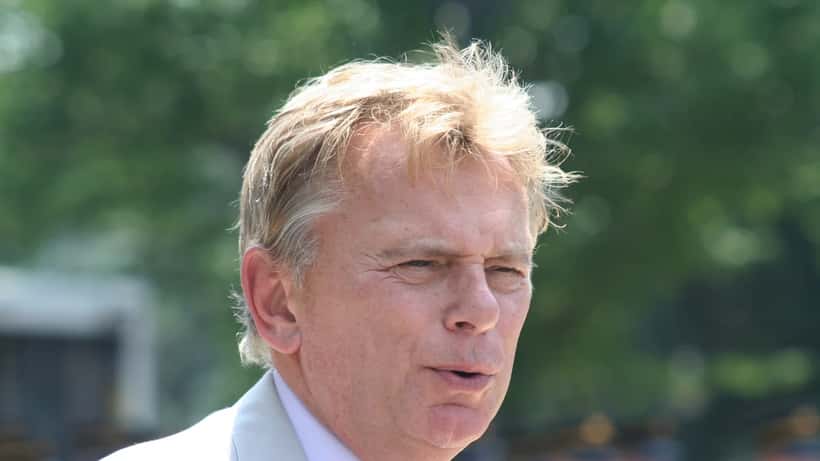 Pat Sajak as grand marshal at Memorial Day Parade, smiling and waving