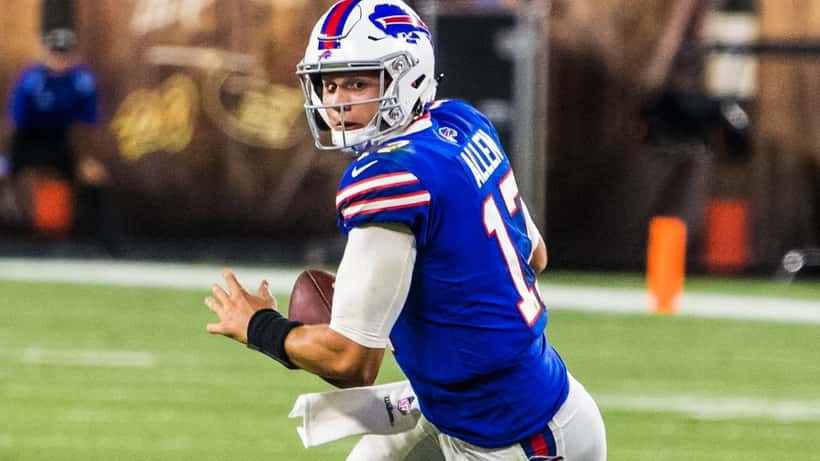 Buffalo Bills quarterback Josh Allen running with the football