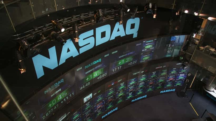 NASDAQ stock market display showing trading data and financial information