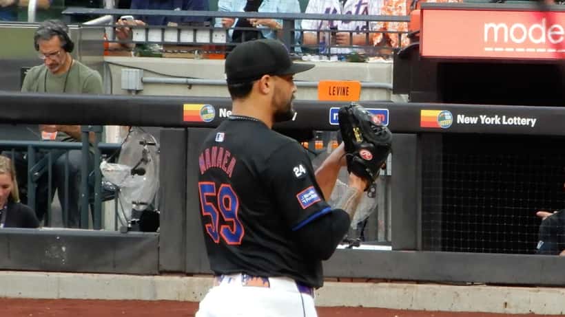 New York Mets pitcher in action, MLB lumbar spine injury and back pain medical analysis