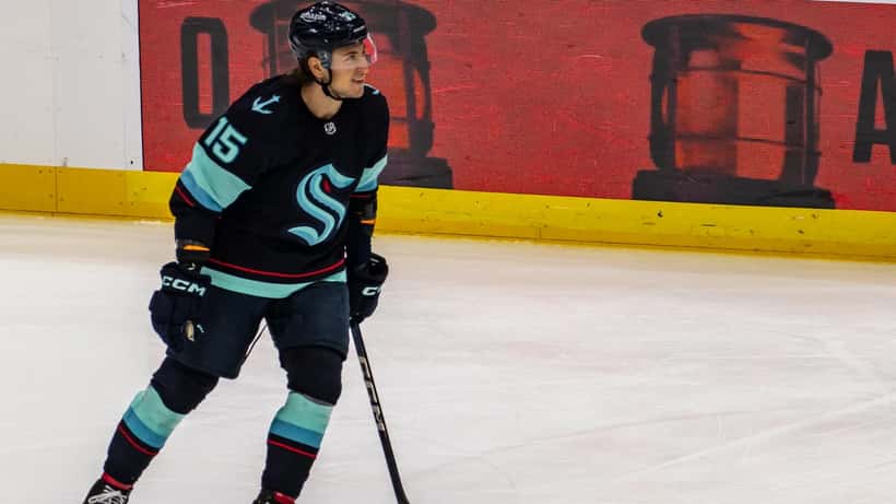 Calgary Flames player celebrates goal on ice during NHL game