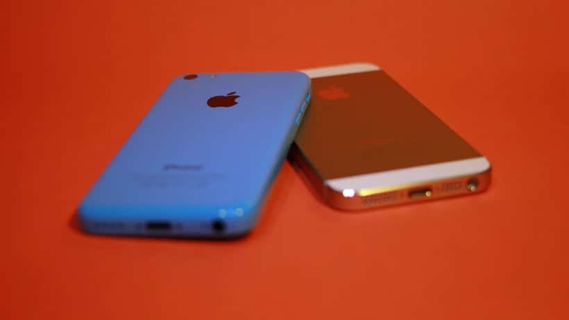 Apple iPhone 5s and 5c smartphones displayed on a surface