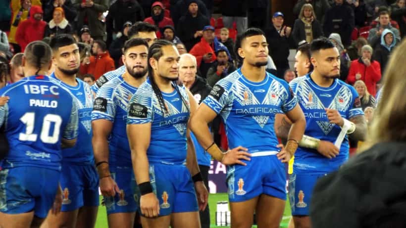 Samoa rugby league team celebrates post-match at the 2021 Rugby League World Cup Final, Spencer Leniu's international side