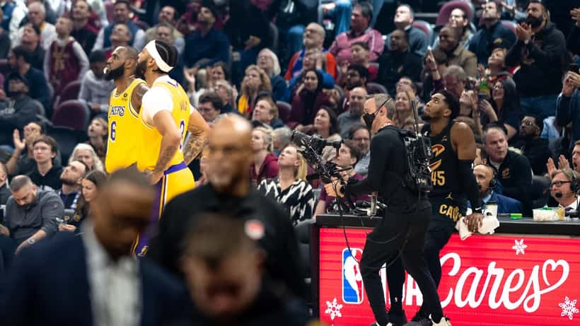 LeBron James playing basketball with teammates on the court