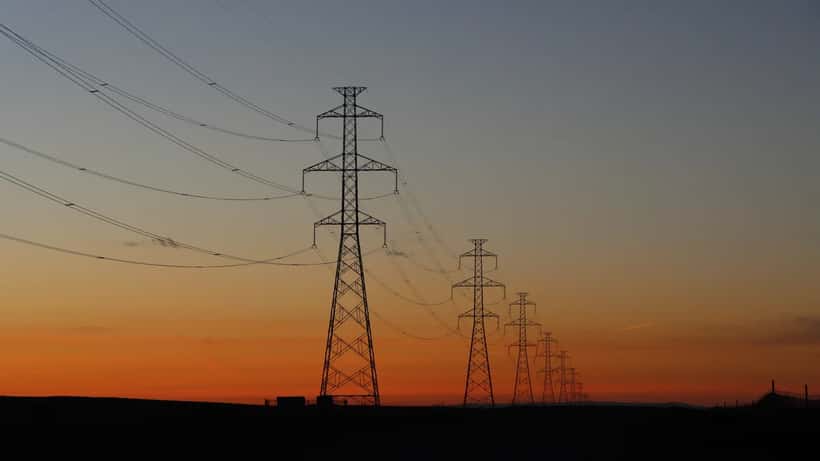 Electric transmission lines at sunset