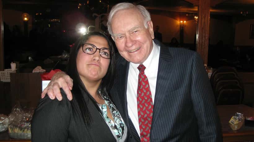 Warren Buffett with a student, discussing finance and investment lessons