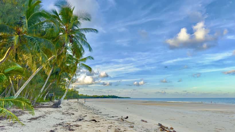 Beach at Mission Beach Queensland showing tropical coastline and clear water