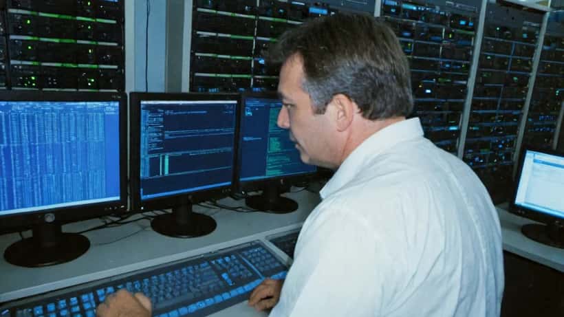 IT security specialist monitoring quantum encryption threats in Australian data centre