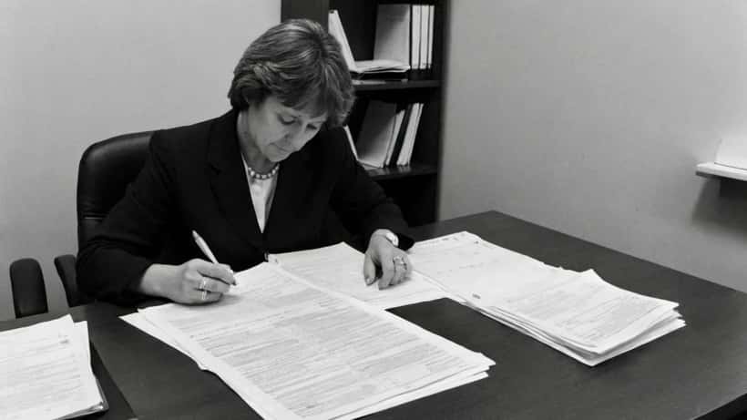 Woman reviewing family law separation documents at a Sydney law office