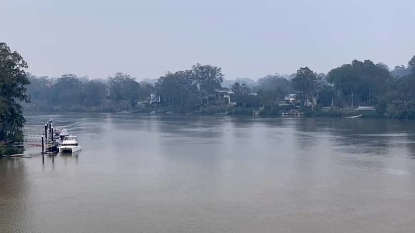 Brisbane River blanketed in orange bushfire smoke haze in Australia