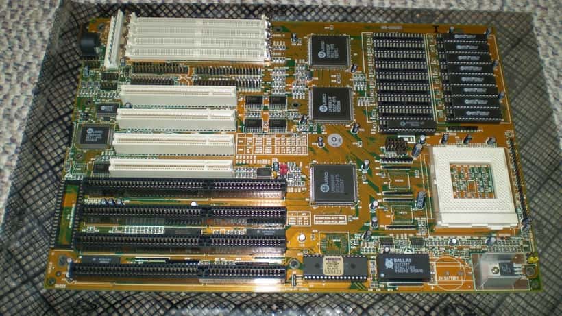 Closeup of a computer motherboard and semiconductor chips illustrating technology investment volatility