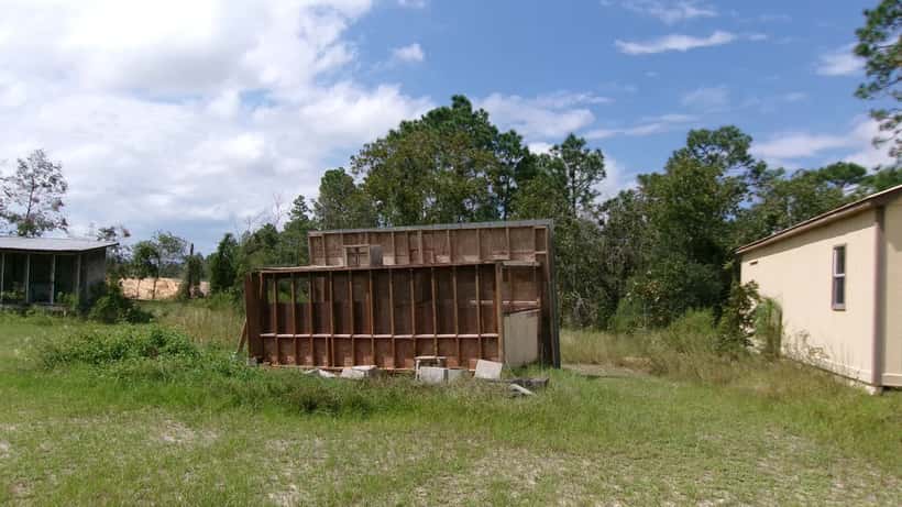 Hurricane structural damage showing roof and walls destroyed by Category 3 storm on Gulf Coast