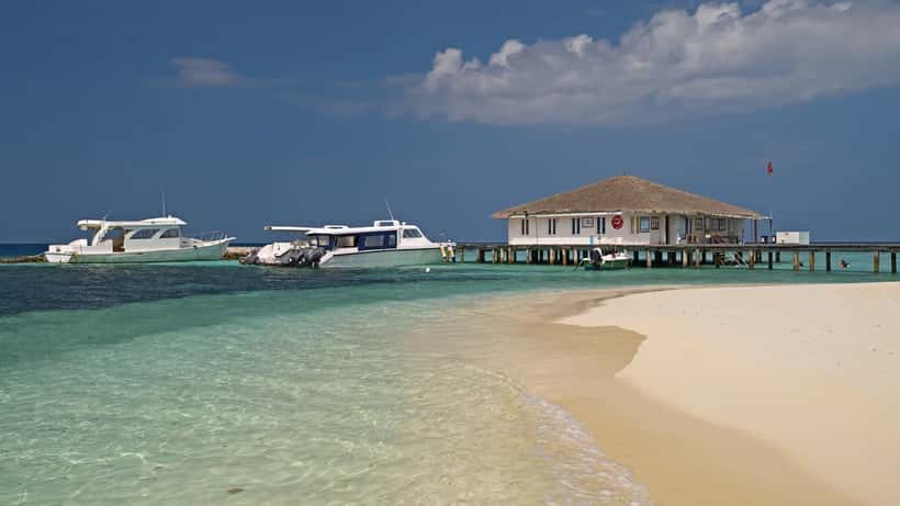 Dive boats moored at a diving center on Eriyadu island in the Maldives