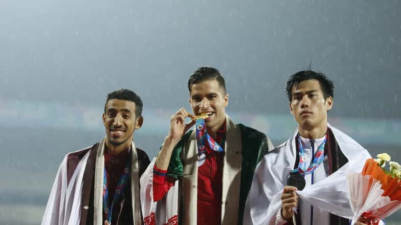 Men's athletics medalists at Asian Games competition podium ceremony