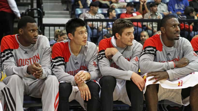 Houston Rockets NBA bench during a game, illustrating professional sports contract structuring