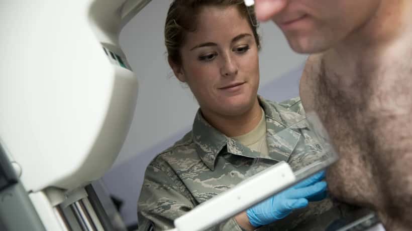 Breast cancer awareness screening event with pink ribbon, mammography clinic setting Australia 2026