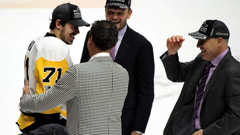 NHL hockey professionals in a professional sports meeting setting