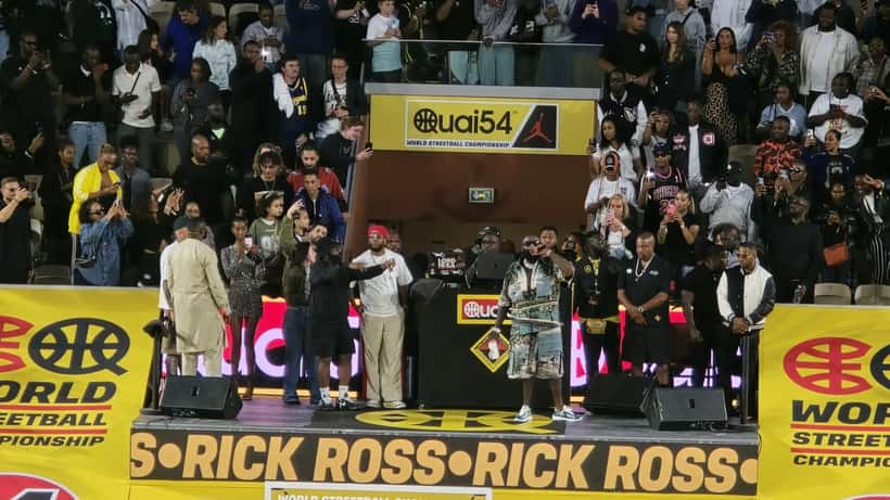 Rick Ross performing on stage, arrested for battery charges in Miami Beach October 2026