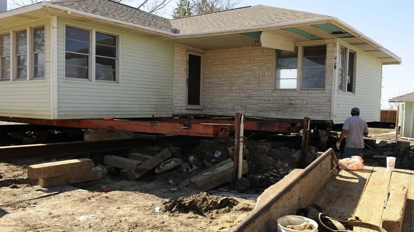 Storm-damaged homes in Sabine Pass, Texas after Hurricane Ike showing roof and structural damage along the Gulf Coast