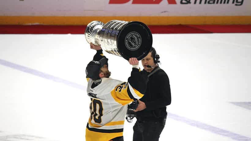 Matt Murray raises the Stanley Cup trophy in 2017, celebrating an NHL championship win