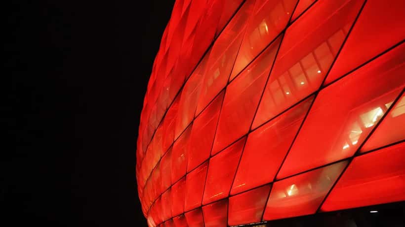 Allianz Arena stadium lit up during a Bundesliga match in Munich Germany