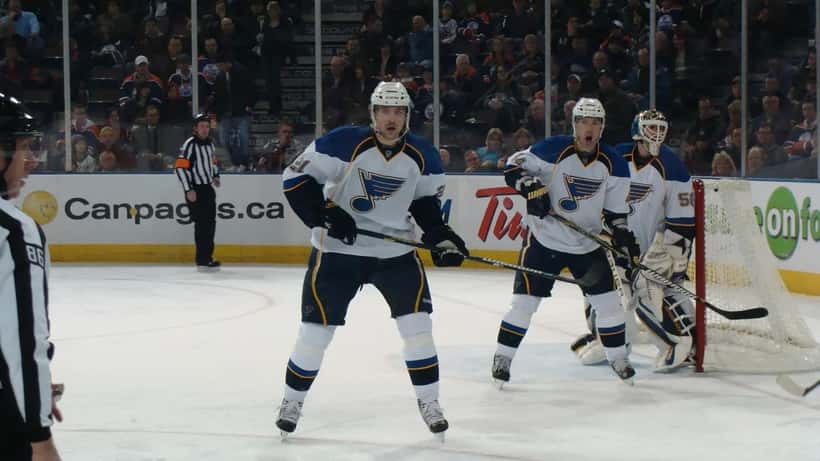 NHL hockey players in action on the ice rink