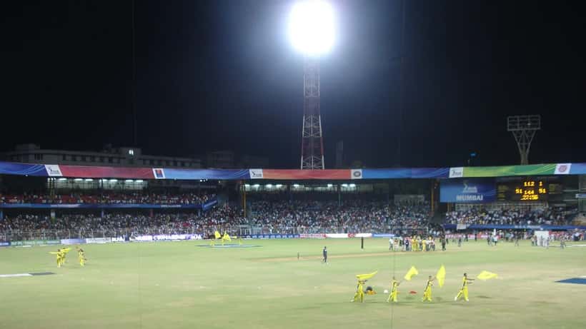Chennai Super Kings IPL cricket team players in yellow jerseys at the stadium