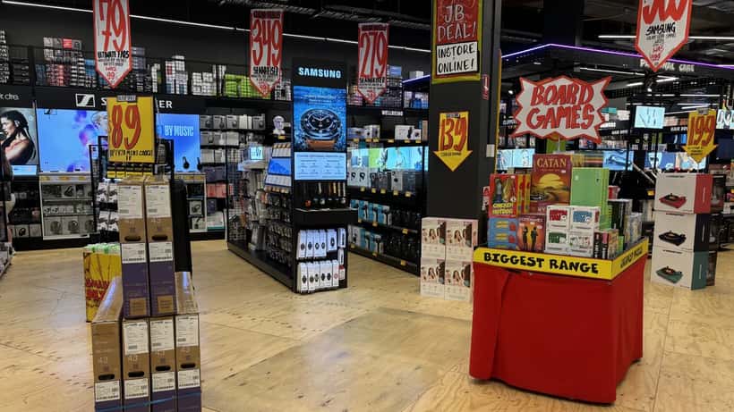 Interior of JB Hi-Fi electronics store in Canberra Centre showing products and price displays