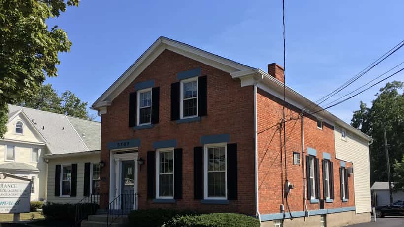 Insurance agency office building representing policyholder rights and claims disputes