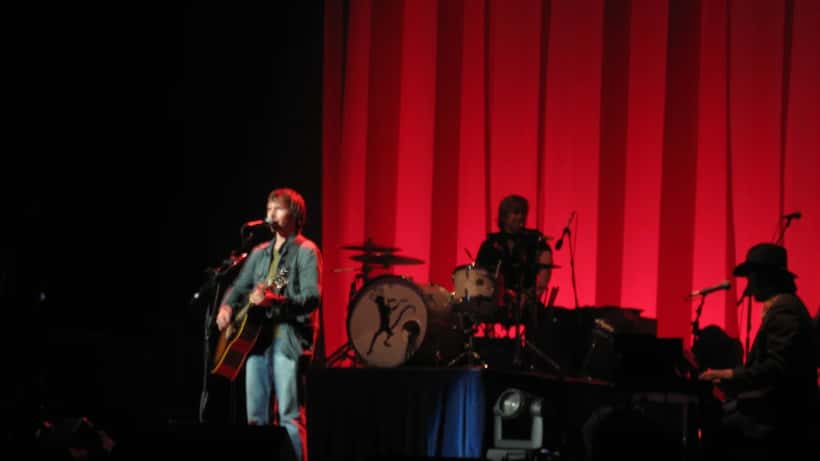 James Blunt performing live on stage at a concert venue