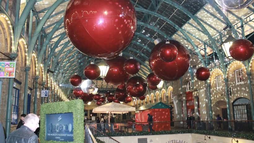 Covent Garden Apple Market Jubilee Hall London busy indoor market with visitors